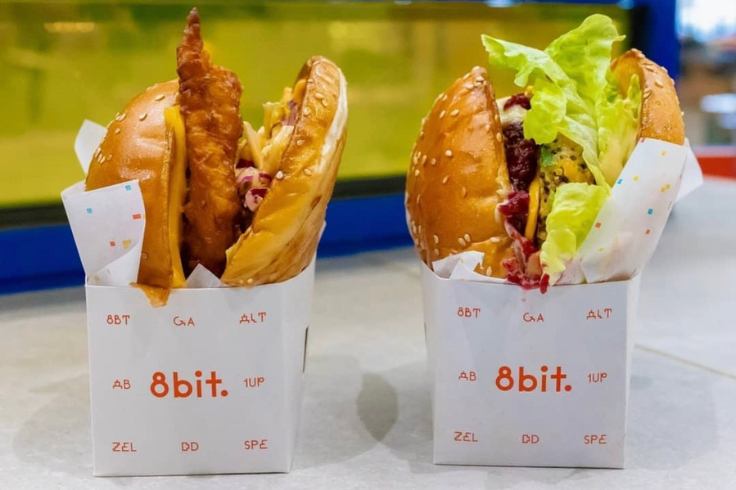 Two burgers in cardboard boxes 