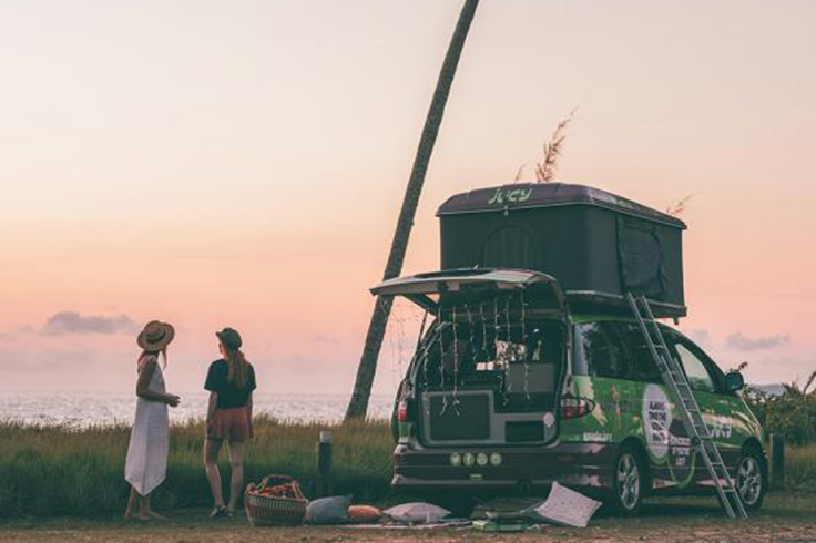 2 girls setting up their JUCY campervan