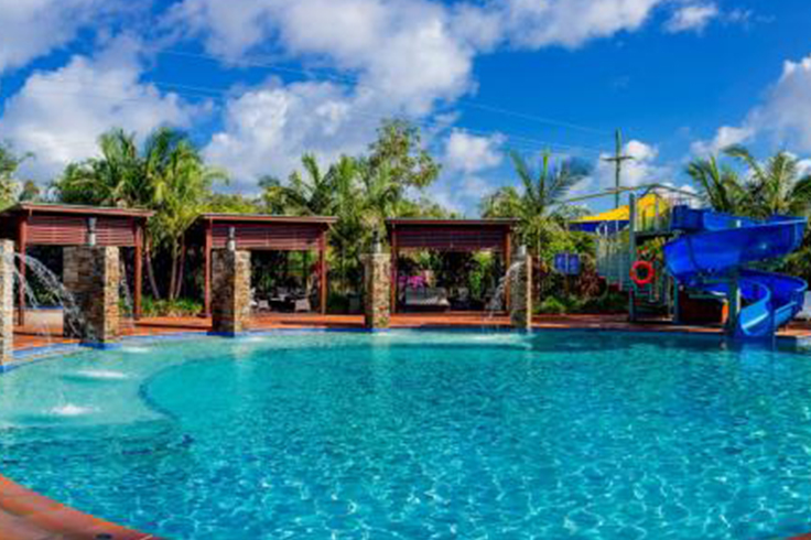 Swimming pool with slide at a holiday park