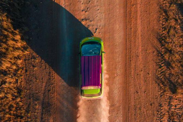 jucy camper kicking up dust in the outback