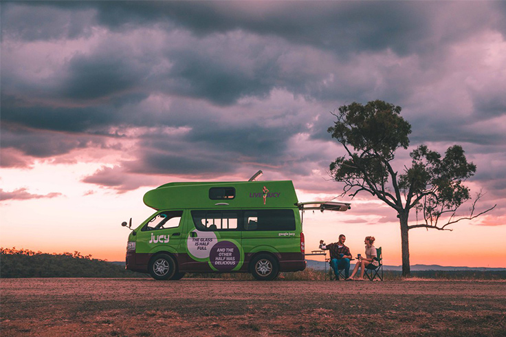 couple-campervan-sitting-drinking