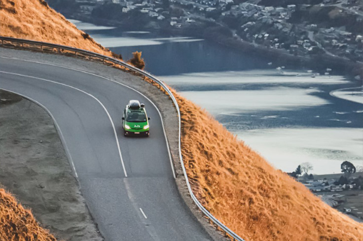 Drone shot of JUCY Ski Wagon driving